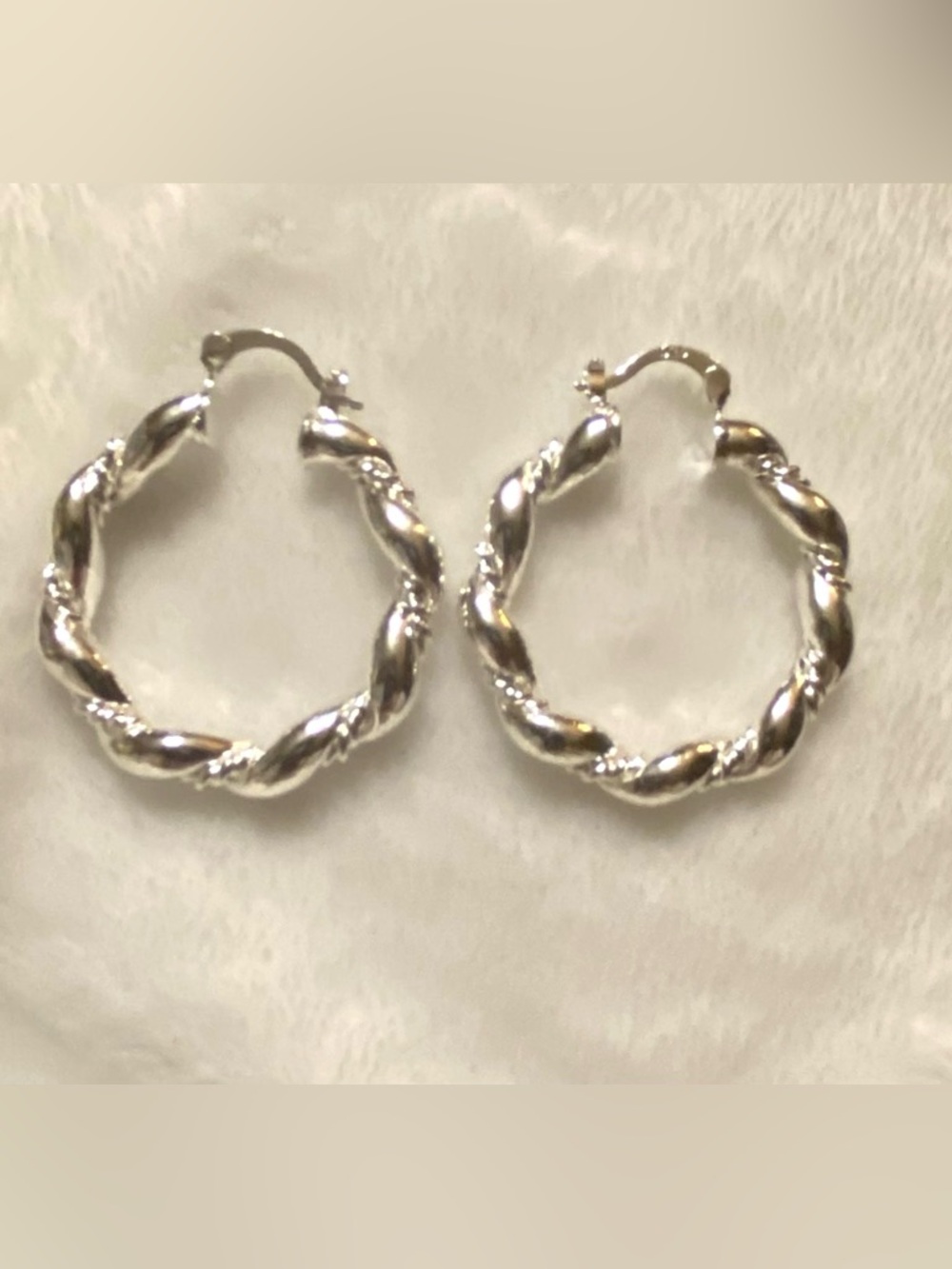 .925 Sterling Silver Twisted Hoop Earring.